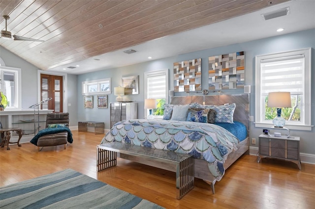 bedroom with ceiling fan, vaulted ceiling, light hardwood / wood-style flooring, and wood ceiling