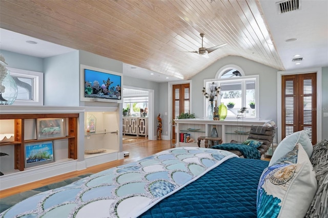 bedroom with ceiling fan, wood-type flooring, vaulted ceiling, and wooden ceiling