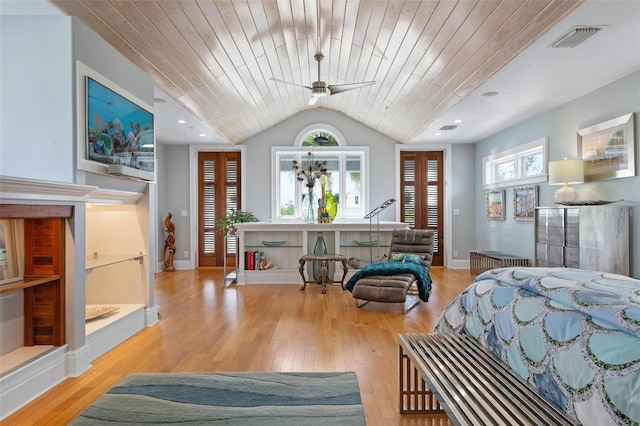 bedroom with wood ceiling, lofted ceiling, and light wood-type flooring