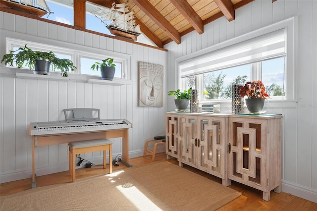 misc room featuring wood ceiling, hardwood / wood-style floors, lofted ceiling with beams, and wooden walls