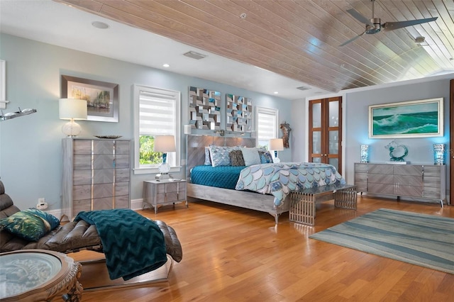 bedroom with wooden ceiling, light wood-type flooring, and ceiling fan