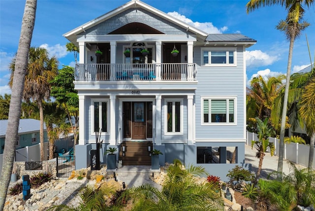 view of front of property featuring a balcony