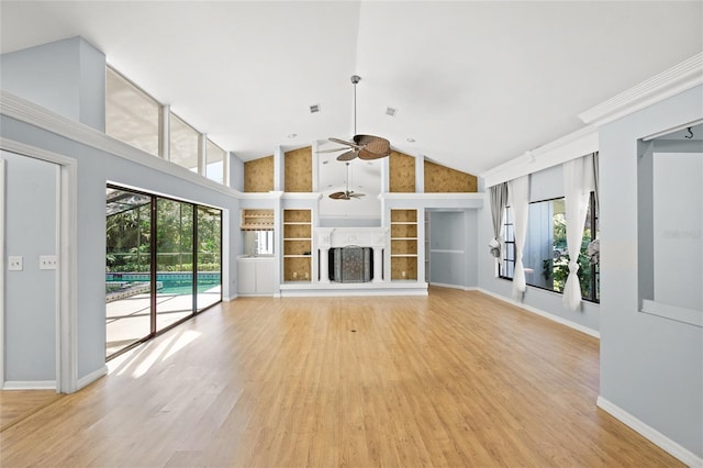 unfurnished living room featuring ceiling fan, light wood-type flooring, and high vaulted ceiling