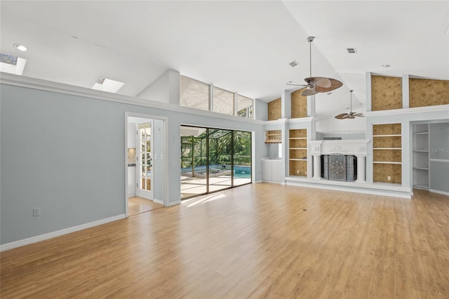 unfurnished living room with ceiling fan, high vaulted ceiling, and light hardwood / wood-style flooring