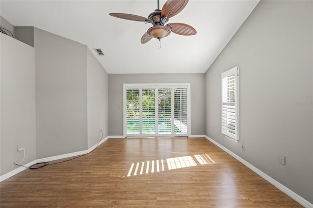 empty room featuring light wood-type flooring, ceiling fan, and lofted ceiling