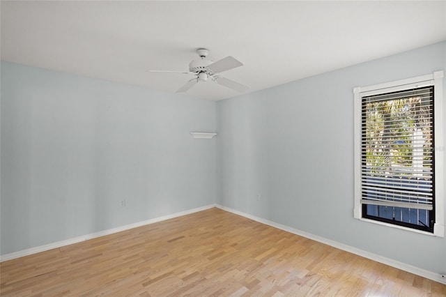 empty room featuring light wood-type flooring and ceiling fan