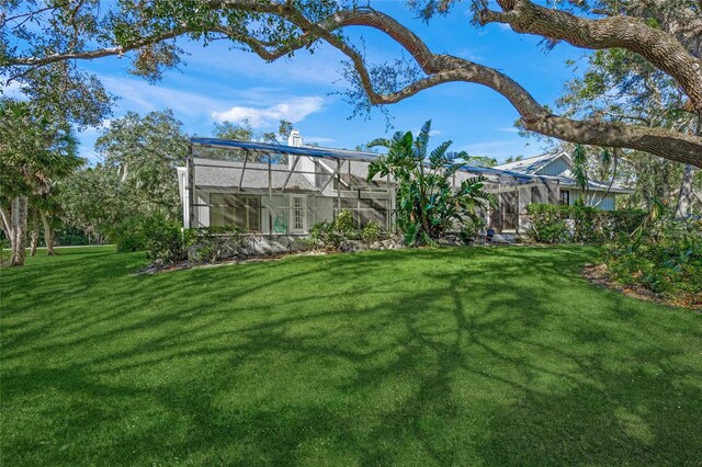 view of yard featuring a lanai