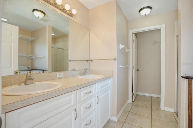 bathroom featuring tile patterned flooring, vanity, and a shower with shower door