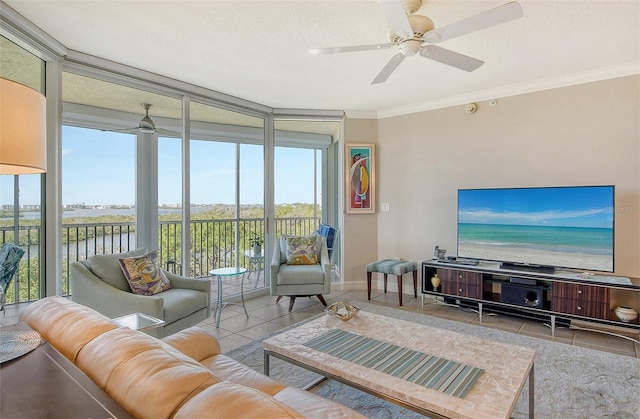 tiled living room with a water view, a healthy amount of sunlight, and crown molding