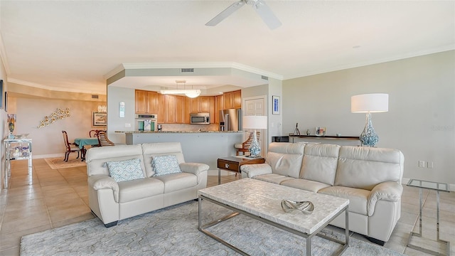 living room with ceiling fan, light tile patterned floors, and ornamental molding