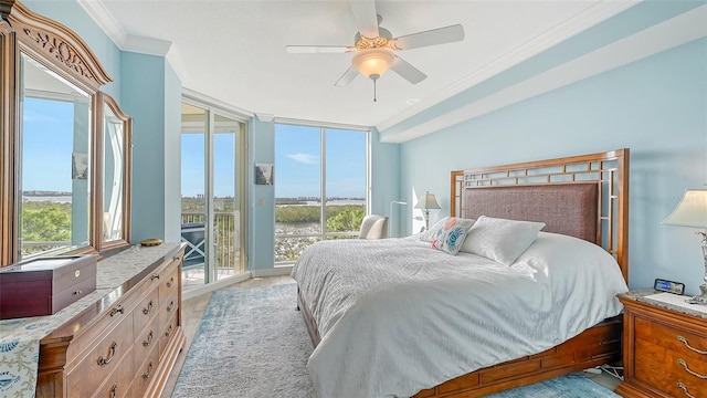 bedroom with ornamental molding, light wood-type flooring, access to exterior, a wall of windows, and ceiling fan