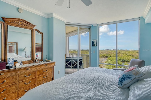 bedroom featuring ornamental molding, access to outside, and multiple windows