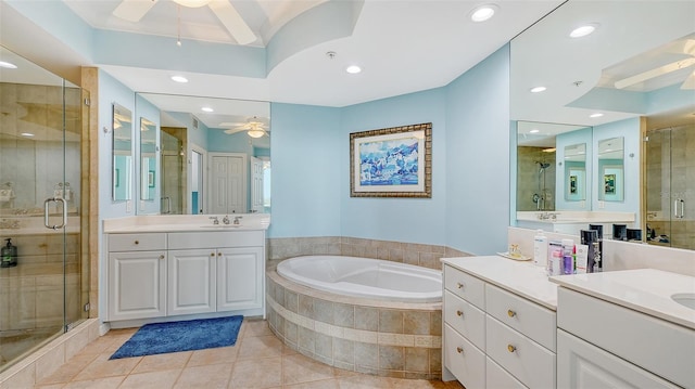 bathroom featuring tile patterned flooring, shower with separate bathtub, and vanity