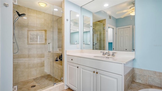 bathroom featuring vanity, ceiling fan, tile patterned floors, and a shower with shower door