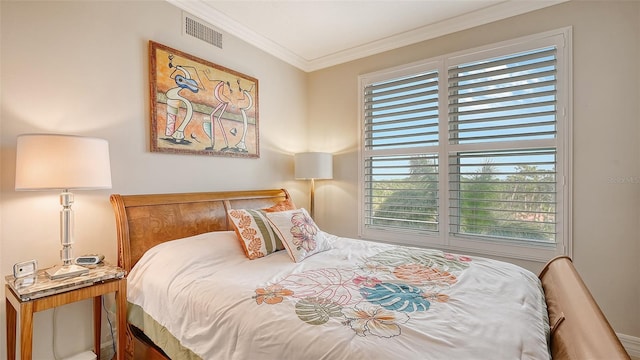 bedroom featuring crown molding