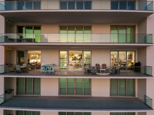 back of house with a patio and a balcony