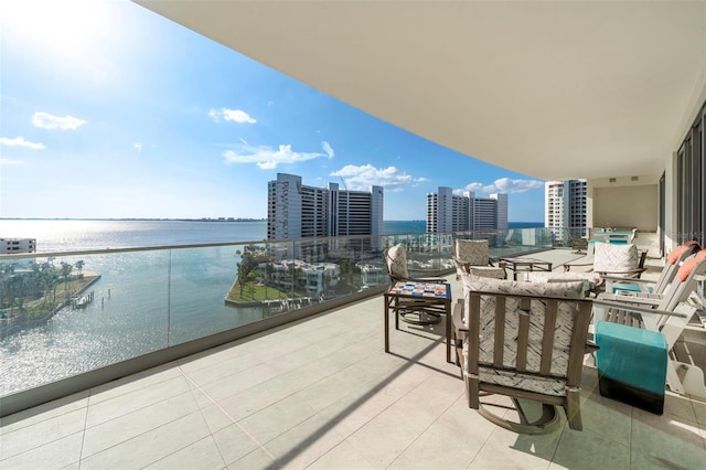 balcony featuring a water view