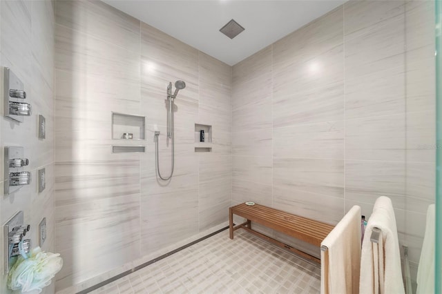 bathroom featuring tile walls