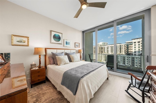 bedroom featuring ceiling fan, access to outside, and floor to ceiling windows