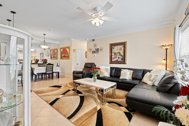 tiled living room featuring crown molding and ceiling fan