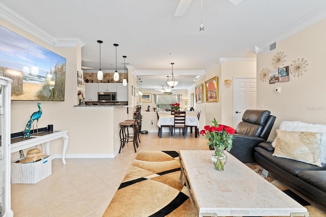4802 51st St W Unit 1010, Bradenton, FL 34210 - living area featuring light tile patterned flooring, ornamental molding, ceiling fan, and baseboards