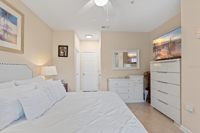 bedroom featuring light tile patterned floors and ceiling fan