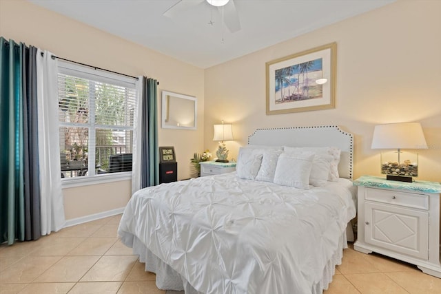 tiled bedroom featuring ceiling fan