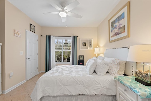 tiled bedroom featuring ceiling fan