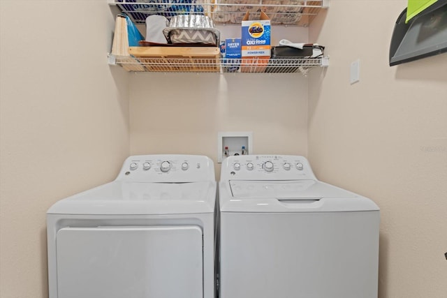 clothes washing area featuring washing machine and dryer