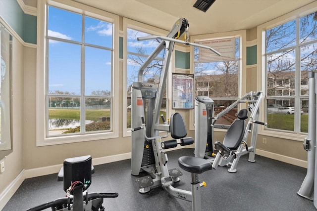 workout area with a water view and plenty of natural light