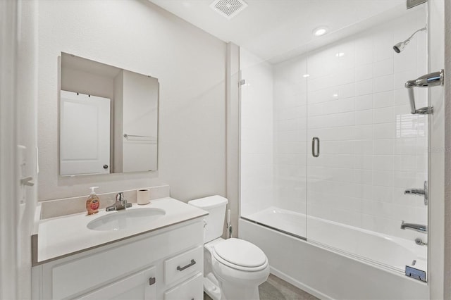 full bathroom with toilet, combined bath / shower with glass door, and vanity