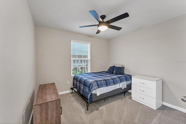 bedroom featuring ceiling fan and light carpet