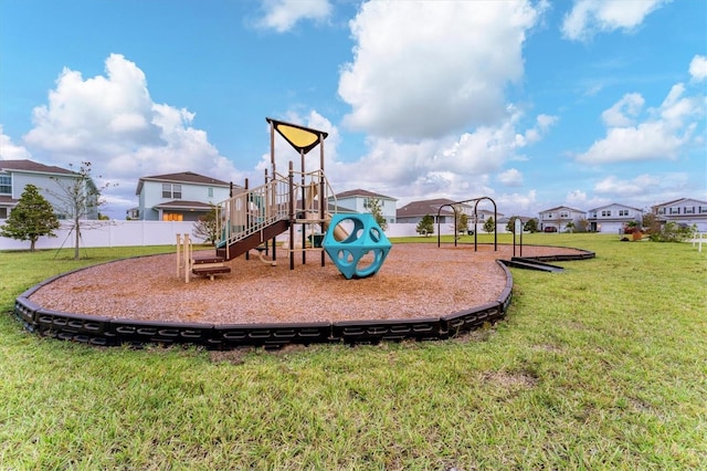 view of jungle gym featuring a lawn