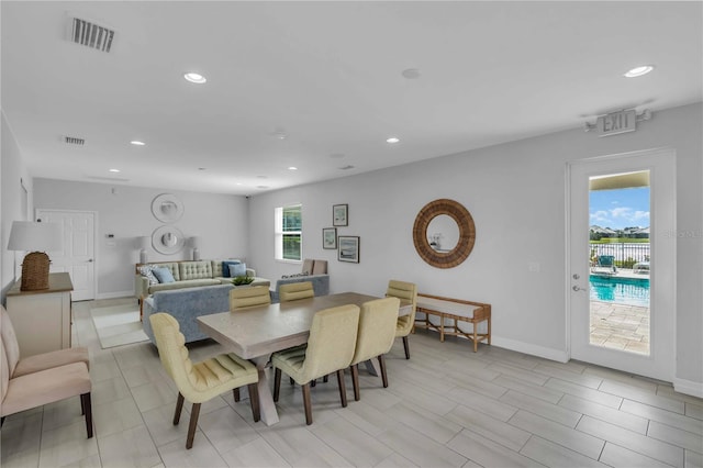 dining space with light hardwood / wood-style flooring