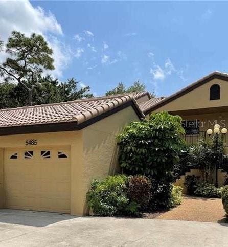 view of side of home with a garage