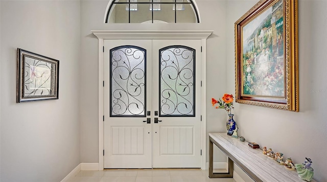 tiled entryway with french doors