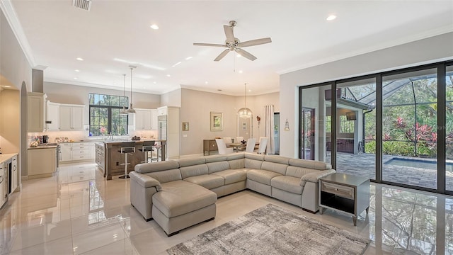 living room featuring light tile patterned floors, ceiling fan, visible vents, and recessed lighting