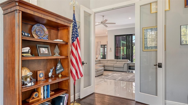 doorway to outside featuring dark wood-style flooring, crown molding, recessed lighting, a ceiling fan, and baseboards