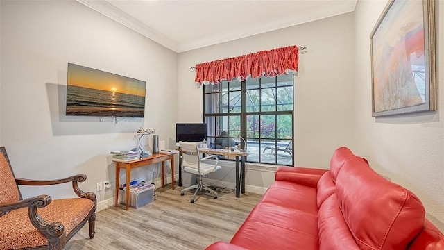 office featuring crown molding, light wood-style flooring, and baseboards