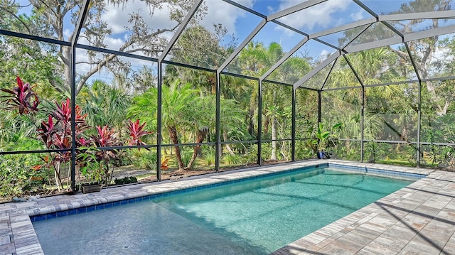 pool featuring a lanai and a patio