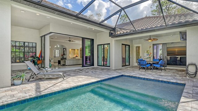 9291 Swaying Branch Rd, Sarasota, FL 34241 - outdoor pool featuring ceiling fan, a patio area, and glass enclosure