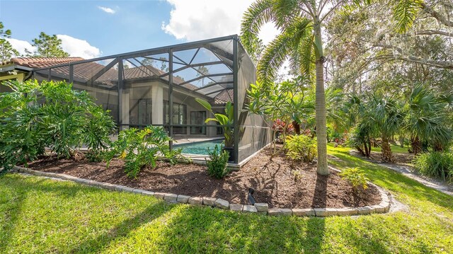 9291 Swaying Branch Rd, Sarasota, FL 34241 - rear view of property featuring an outdoor pool, a yard, and a lanai
