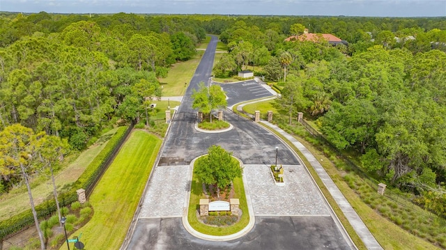 birds eye view of property with a wooded view