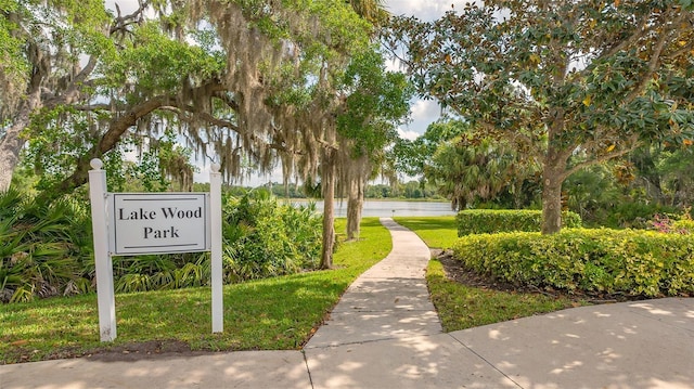 9291 Swaying Branch Rd, Sarasota, FL 34241 - view of community featuring a water view and a yard