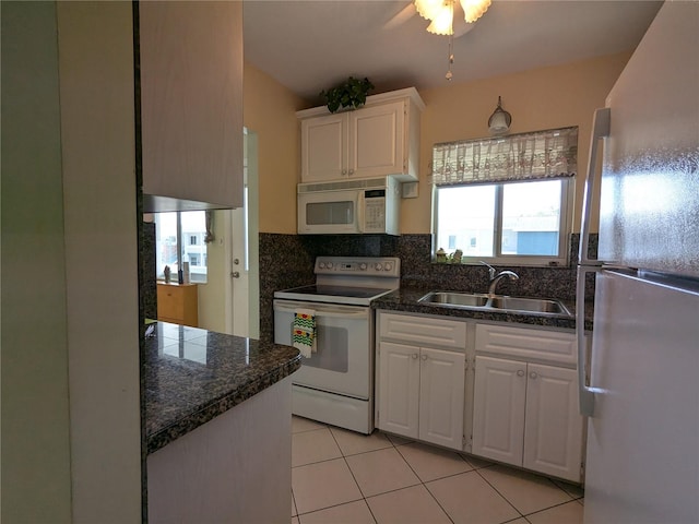 kitchen with ceiling fan, light tile patterned floors, white cabinetry, sink, and white appliances