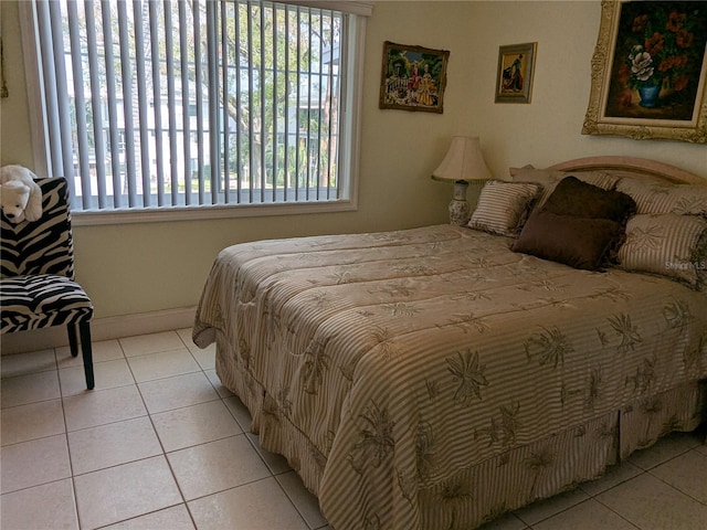 bedroom featuring light tile patterned flooring