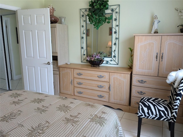 bedroom featuring light tile patterned floors