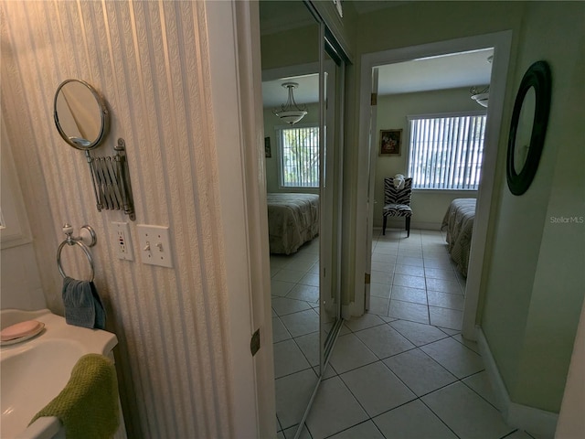 corridor with light tile patterned floors