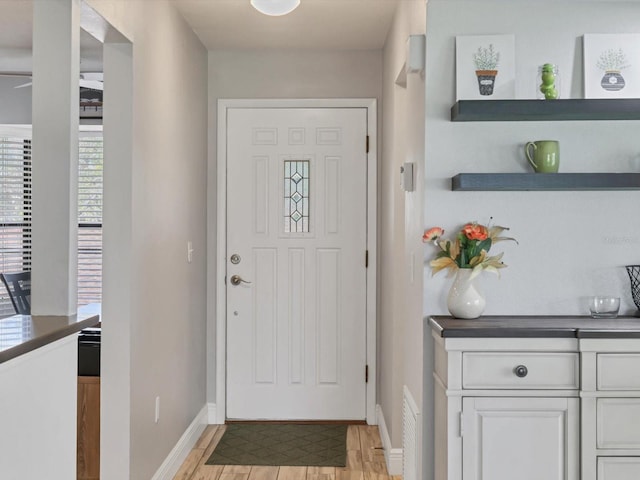 entryway with light hardwood / wood-style flooring