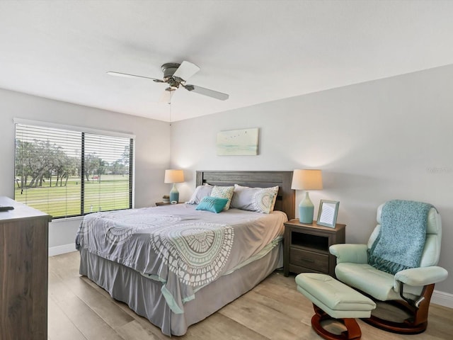 bedroom featuring light wood-type flooring and ceiling fan